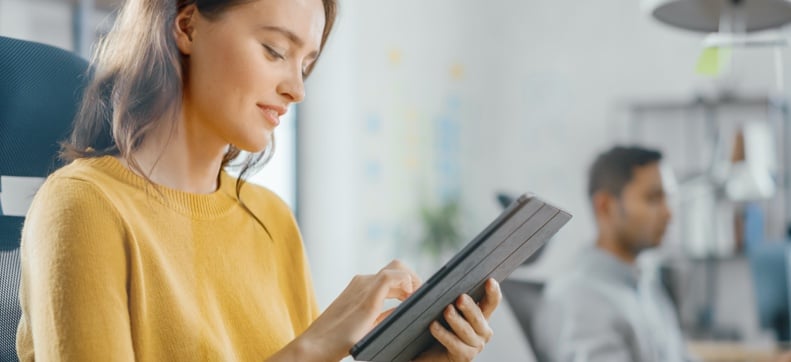 Female office worker on tablet