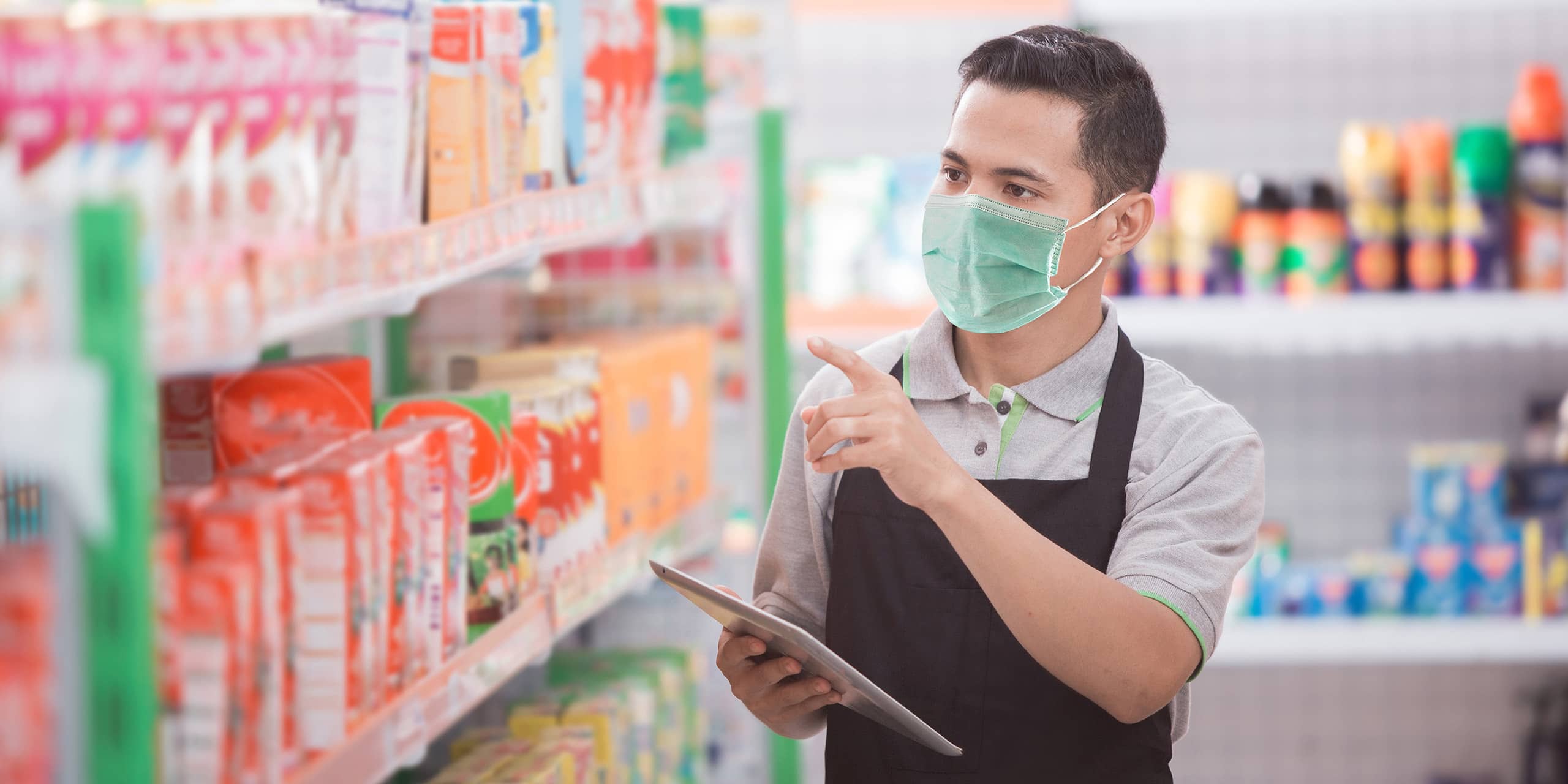 Retail employee checking products on shelves